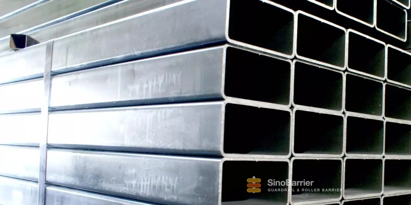 Hot-dip galvanized steel guardrail posts stacked at the factory